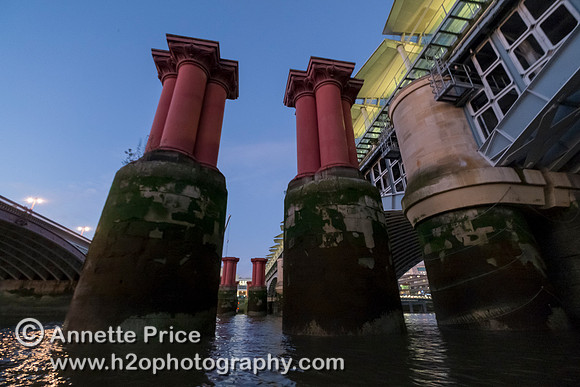 Pillars that formed part of the original railway bridge at Blackfriars. River Thames, London