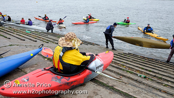 Paddlers getting onto the water at Barn Elms for Christmas Dinner paddle to the Ship pub in Mortlake