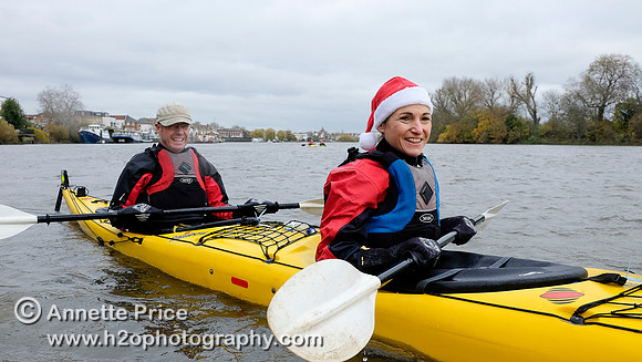 Paddlers on the R. Thames paddling to the Ship pub in Mortlake for Christmas Dinner