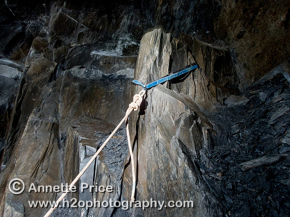 Rigging the SRT rope to descend to the bottom of Gaewern Slate Mine. North Wales, UK