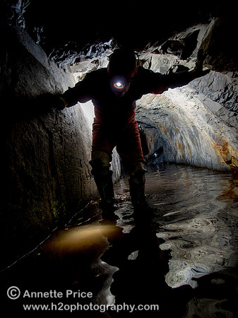Caver Neil Montgemery in the tunnel entrance to Gaewern Slate Mine. North Wales, UK