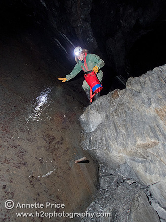 Caver Siriol Richards climbing down the mine workings in Gaewern Slate Mine. North Wales, UK