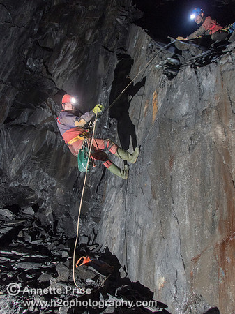Neil Montgomery on a short abseil to the bottom of the mine workings. Gaewern Slate Mine.