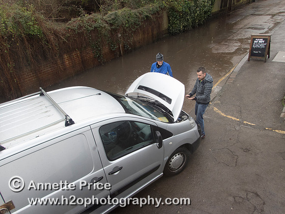 High water on the River Thames.   A car drowns outside the White Swan Pub - Twickenham, London.