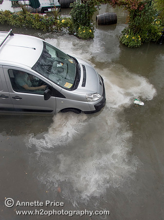 High water on the River Thames.   A car drowns outside the White Swan Pub - Twickenham, London.