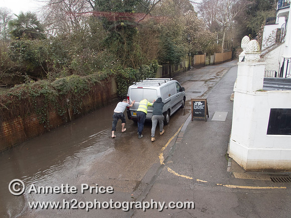 High water on the River Thames.   A car drowns outside the White Swan Pub - Twickenham, London.