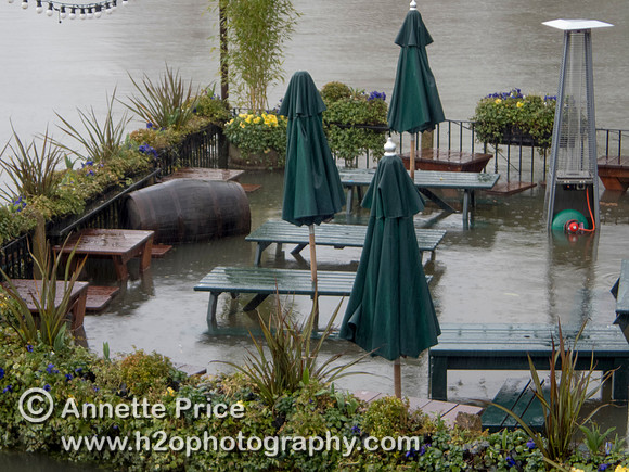 High water on the River Thames. White Swan Pub - Twickenham, London.
