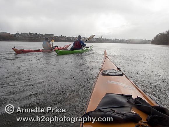 Kayaking on the River Thames near Chiswick, in the rain. London