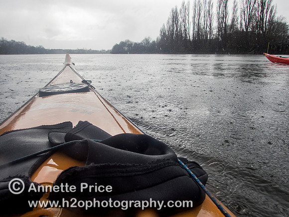 Kayaking on the River Thames near Chiswick, in the rain. London