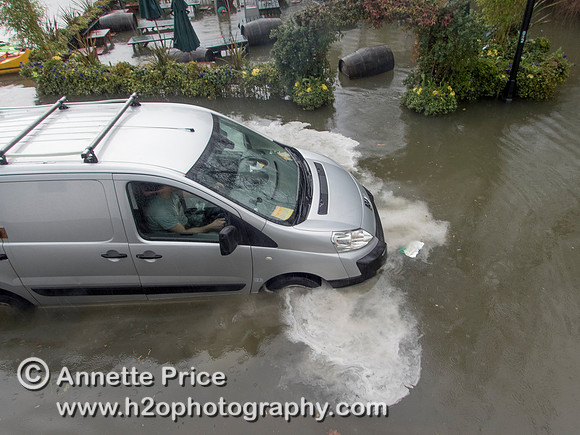 High water on the River Thames.   A car drowns outside the White Swan Pub - Twickenham, London.