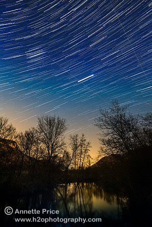 Star trails over the River Ceou, France