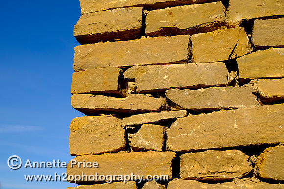 Large gaps are left in the Cotswold stone walls for insects to live in. The Habitat House.