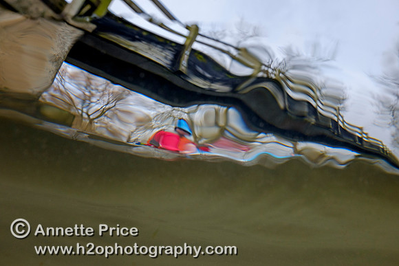 Seen from underwater - Paddler Mark Villa Vercella on the River Thames at Lechlade.