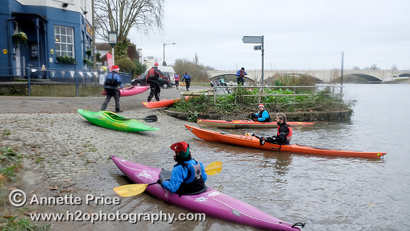 Kayak paddlers arriving at the Ship pub in Mortlake for Christmas Dinner