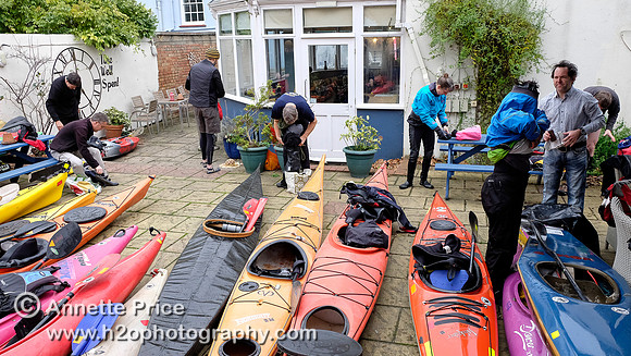 Kayaks parked in the beer garden at the Ship pub, while their owners enjoy Christmas Dinner.