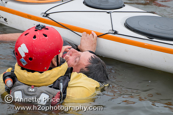On-the-water. Training kayak paddlers to rescue swimmers