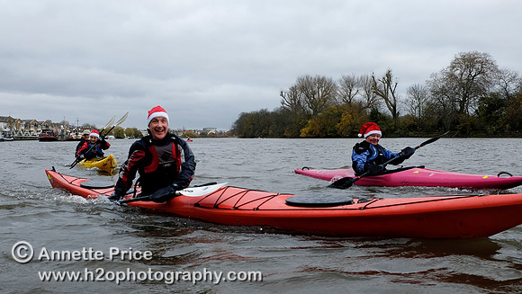 Paddlers on the R. Thames paddling to the Ship pub in Mortlake for Christmas Dinner